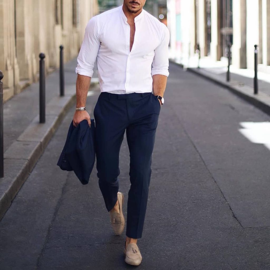 Mandarin collar white button-down shirt, blue suit, and suede loafers