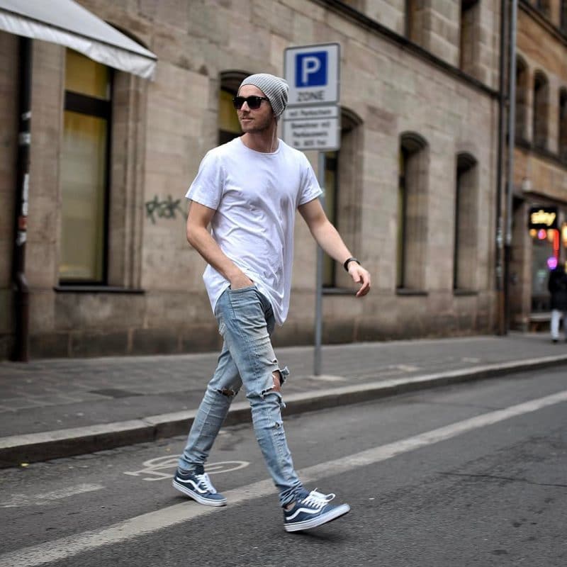 Loosen white plain tee shirt, blue jeans, sunglasses and beanie hat