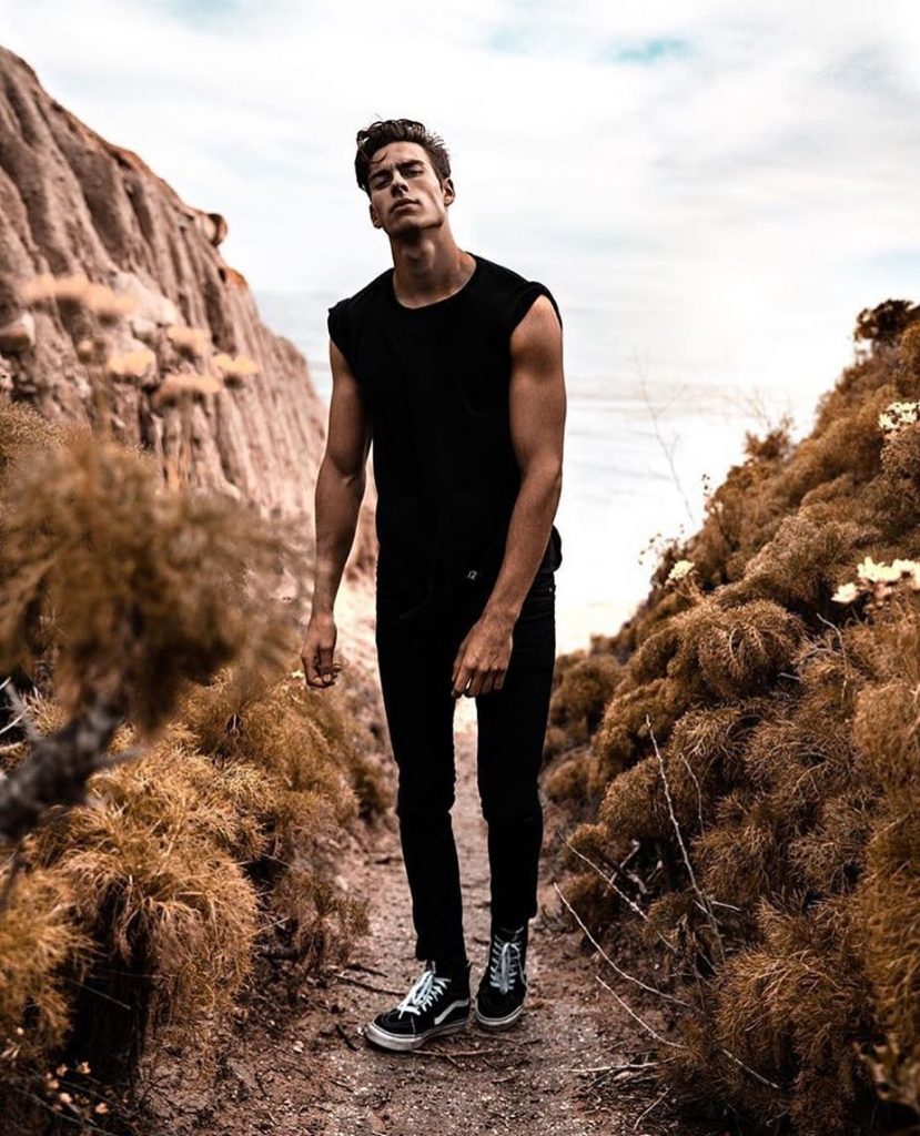 Black tee, black jeans, boots