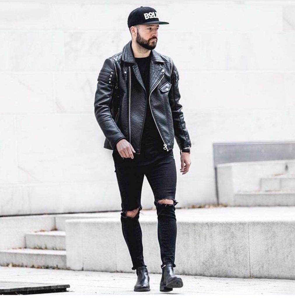 Leather biker jacket, tee, jeans, boots, snapback hat