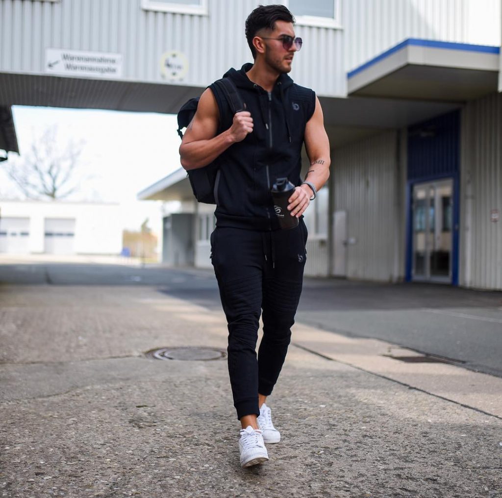 Black zip tank top, jogger pants, sneaker