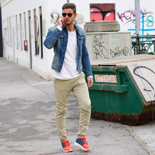 Blue denim jacket, white tee, beige chinos, sneaker.