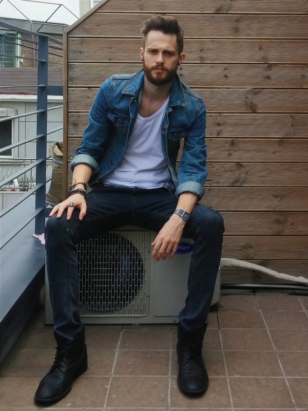 Blue denim jacket, white singlet, blue jeans, black boots