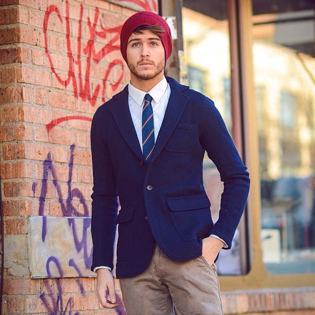 Red slouch beanie hat, blue blazer, white shirt, blue pinstripe tie, brown khaki pants 1