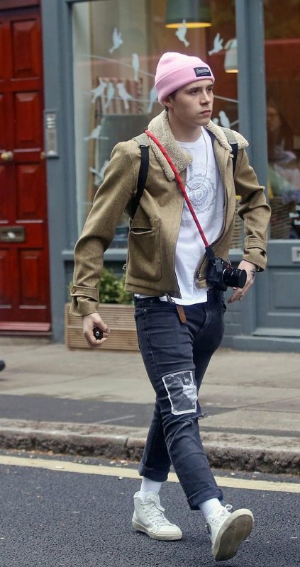 Brooklyn Beckham with pink cuffed slouchy beanie hat, shearling jacket, print tee 1