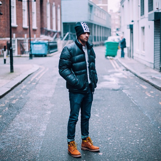 Black down jacket, white sweater, beanie hat, jeans 1