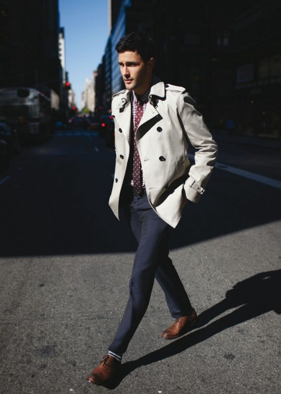 White trench coat, checked shirt, patterned tie, blue suit pants, brogue shoes. 1