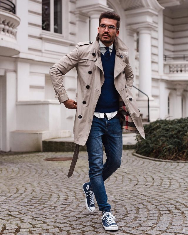 Tan trench coat, blue sweater, tie, jeans, white shirt, sneaker 1