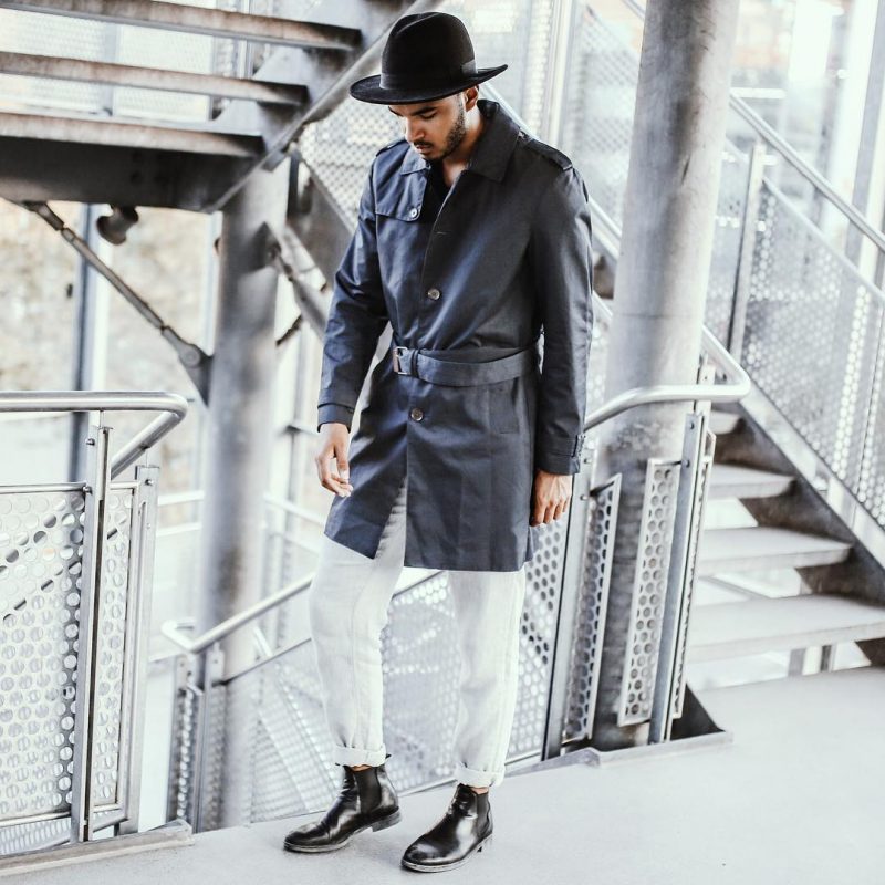 Black trench coat, white jeans, fedora hat, leather Chelsea boots 1