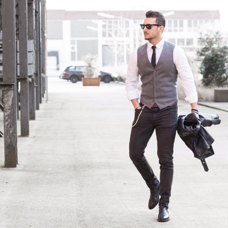 40 mens winter work outfit styles with winter boots. Leather Chelsea boots, white shirt, tie, suit vest, black jeans 1